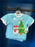 Universal Studios - Super Nintendo World Christmas 2024 - Mario Snowman Light Blue Crew Neck T-shirt (Youth)