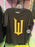 Universal Studios - Wicked: For Good - Golden “W” Logo Black T-shirt (Adult)