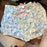 WDW - Mickey Logo Castle Est ‘71 All-Over-Print Shorts (Adult)